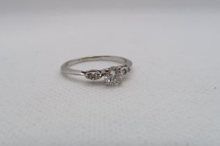 A 14ct white gold diamond ring with diamond shoulders - centre diamond approx 0.5ct - diamonds are
