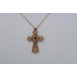 A 9ct yellow gold (hallmarked) filigree cross pendant with red garnet - approx 3.5cm - on a 9ct