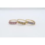 Three 9ct yellow gold (hallmarked) rings with coloured stones - ring sizes R/S, U/V & Q - approx