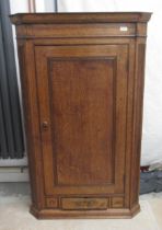 An oak corner cupboard - 122cm x 76cm