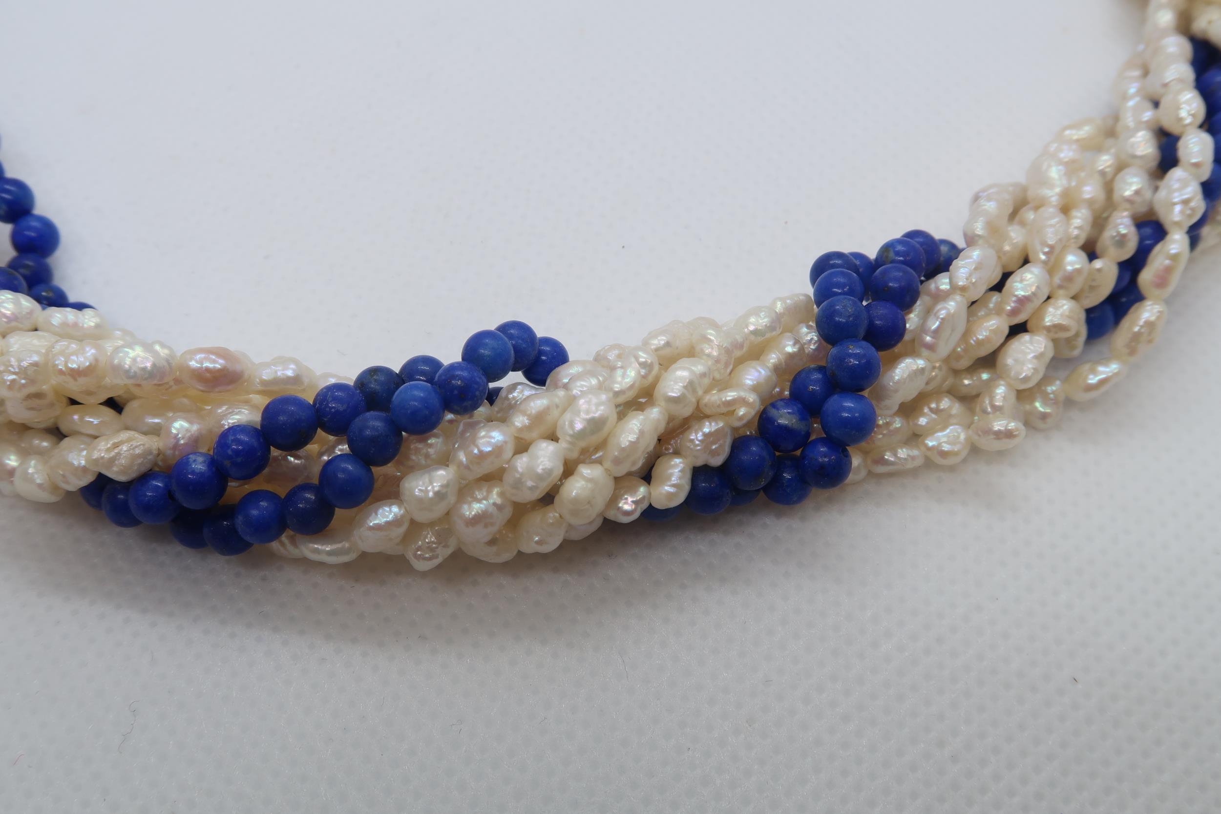 A cultured freshwater pearl and lapis beaded Lapis Lazuli necklace with 9ct gold (hallmarked) oval - Image 4 of 4