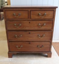 A small two over three mahogany chest of drawers - 77cm x 67cm x 41cm