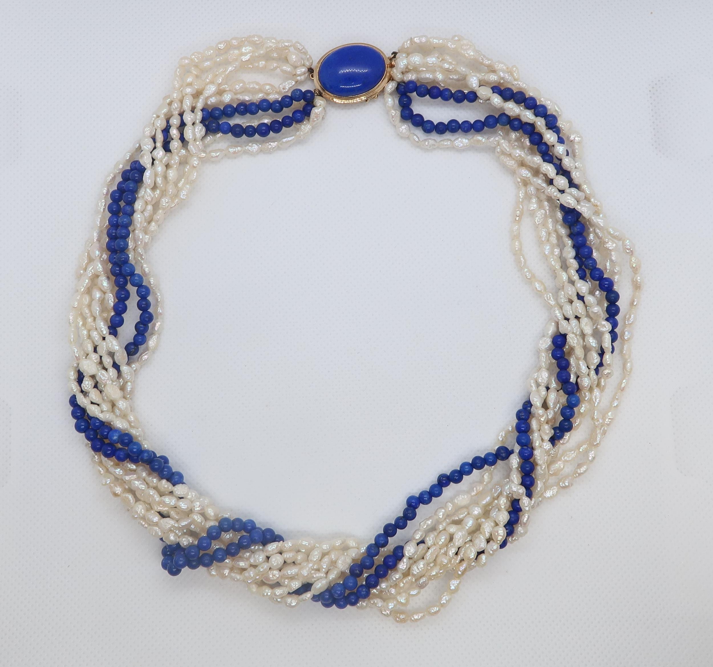 A cultured freshwater pearl and lapis beaded Lapis Lazuli necklace with 9ct gold (hallmarked) oval