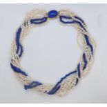 A cultured freshwater pearl and lapis beaded Lapis Lazuli necklace with 9ct gold (hallmarked) oval