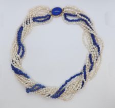 A cultured freshwater pearl and lapis beaded Lapis Lazuli necklace with 9ct gold (hallmarked) oval