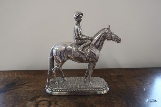 A silver filled figure of a horse and jockey hallmarked Sheffield 1987 and inscribed Sheldon -