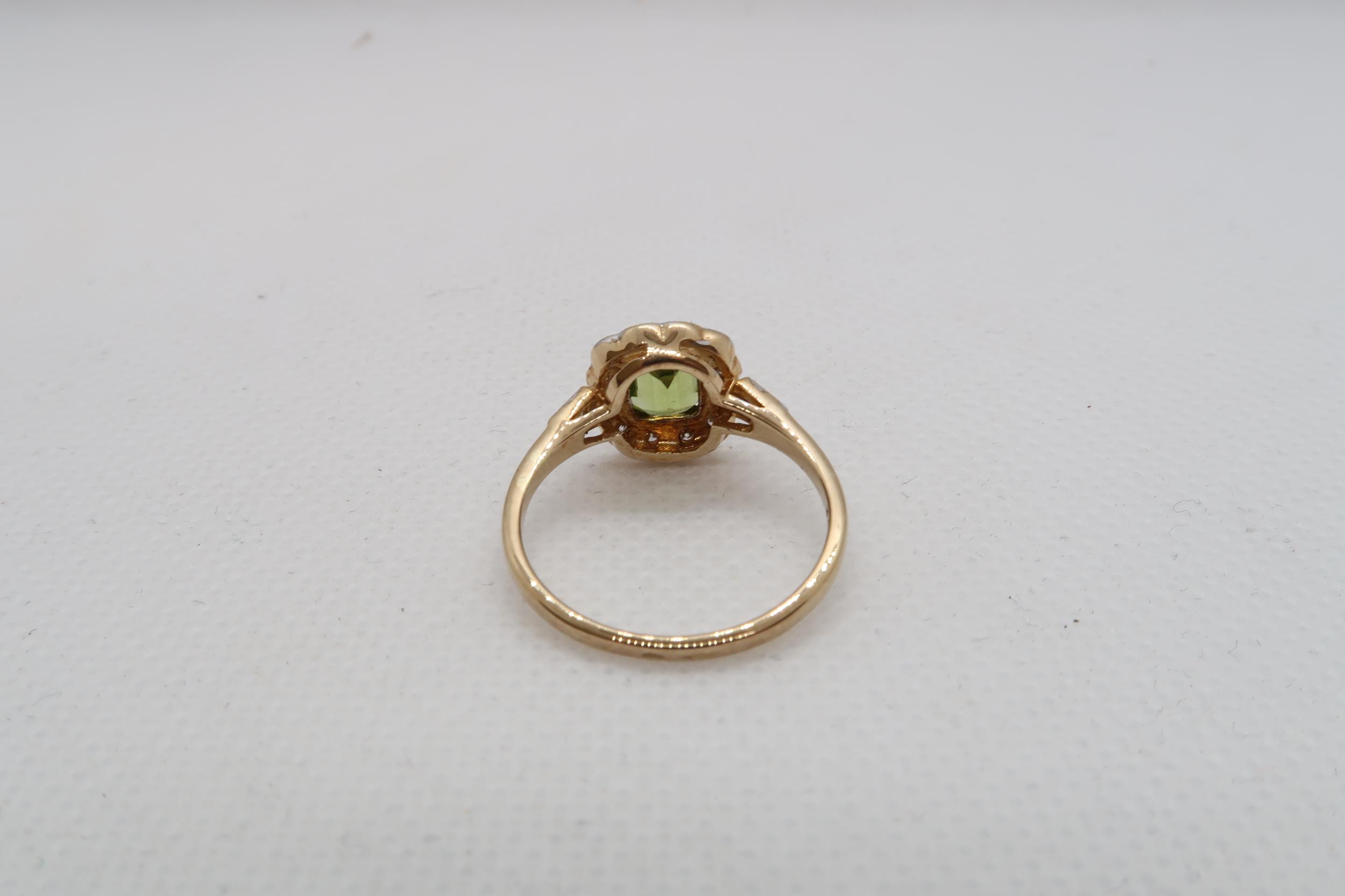 A 9ct yellow gold Peridot and diamond ring with diamond shoulders - head size approx 11mm x 11mm - - Image 3 of 4