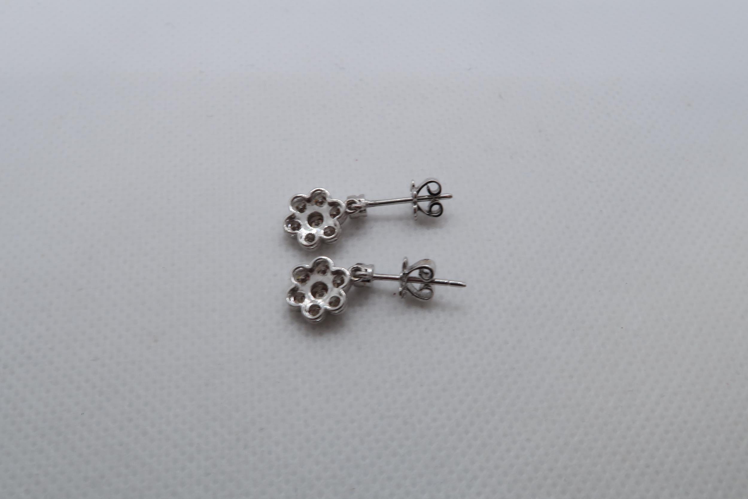 A pair of 18ct white gold daisy style diamond set cluster drop earrings, boxed - round brilliant cut - Image 2 of 2