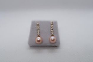 A pair of 9ct yellow gold pink cultured pearl drop earrings with long bales set with diamonds, boxed