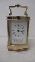 An Asprey serpentine case brass carriage clock with hand painted dial - working, with key - approx