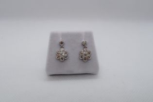 A pair of 18ct white gold daisy style diamond set cluster drop earrings, boxed - round brilliant cut