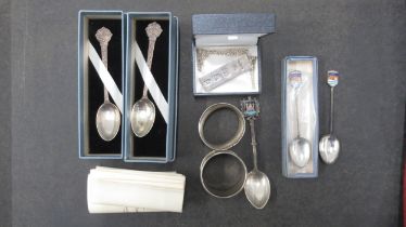 Silver - Ingot and chain, two napkin rings and five spoons - total approx weight 3.4 troy oz