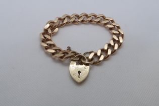 A 9ct yellow gold (hallmarked) albert link bracelet with heart lock - 48.5 grams