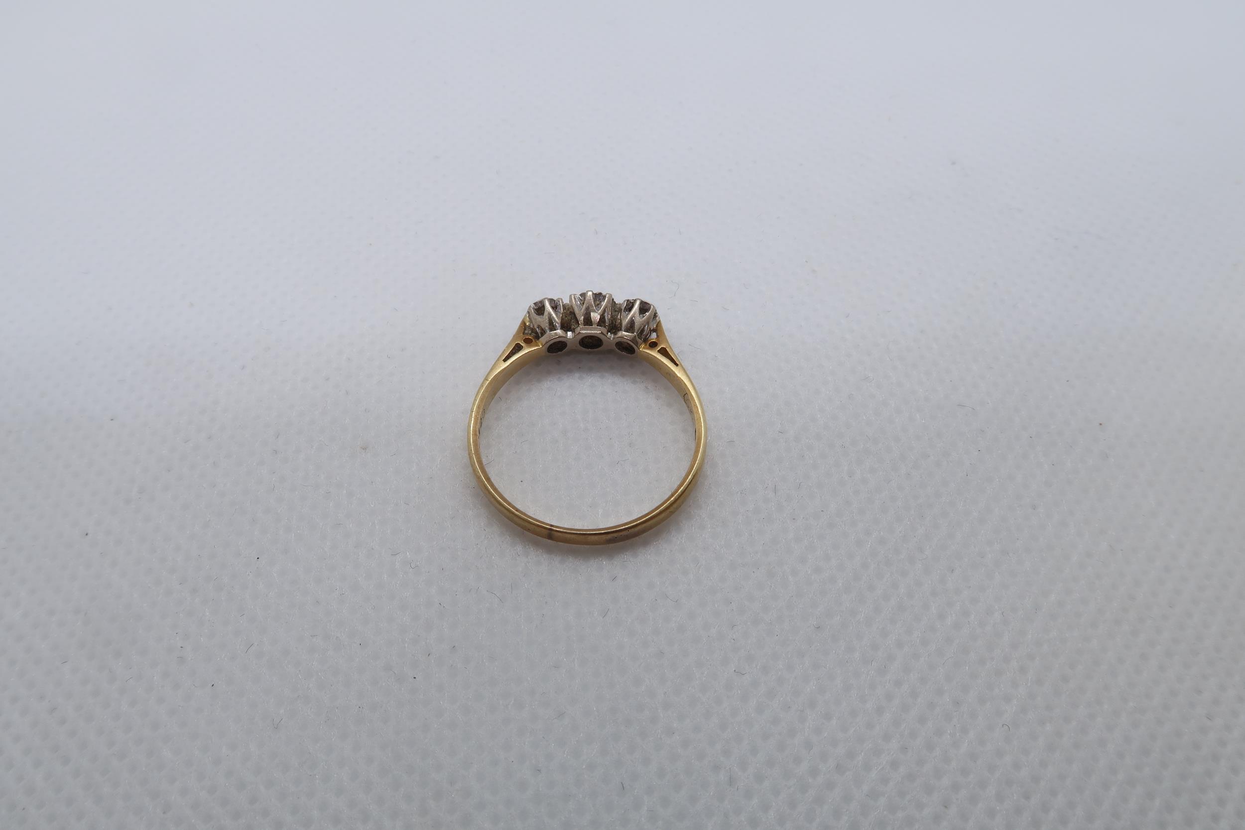 An 18ct yellow gold (hallmarked) three stone diamond ring size R - weight approx 2.8 grams - Image 3 of 3