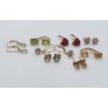 Eight pairs of 9ct gold earrings