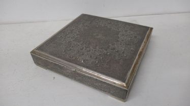 An Eastern silver desk box with finely chased decoration - 18cm x 18cm x 3cm - good overall