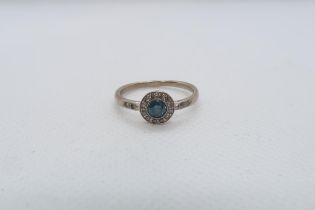 A 14ct white gold (hallmarked) blue diamond ring - the central round brilliant cut blue diamond