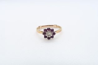 An 18ct yellow gold (hallmarked) amethyst and diamond daisy cluster ring size O - approx weight 2.