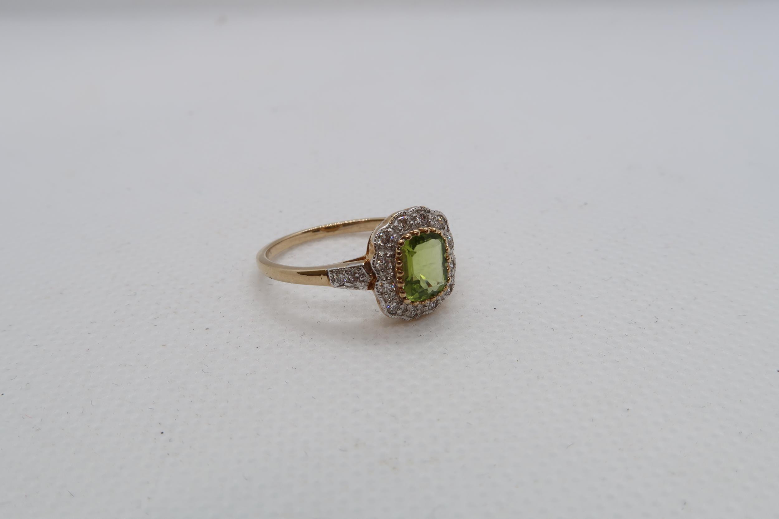 A 9ct yellow gold Peridot and diamond ring with diamond shoulders - head size approx 11mm x 11mm - - Image 2 of 4