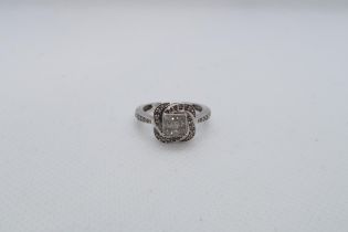 A 9ct white gold (hallmarked) diamond cluster ring with nine central square cut diamonds - ring size