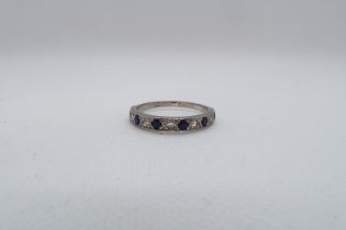 A sapphire and diamond half eternity ring set in white gold - ring size Q/R - weight approx 2.8
