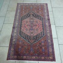 A Hamadan hand knotted woollen rug - 2.26m x 1.30m