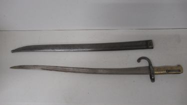 A 19th century French Chassepot 'Yataghan' Bayonet in matching steel scabbard - blade approx 56cm