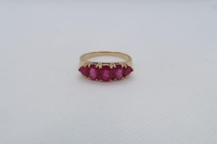 A 14ct yellow gold (hallmarked) and ruby five stone bridge ring size R/S - weight approx 3.7 grams