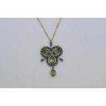 A 9ct yellow gold and silver vintage style necklace set with peridots, diamonds and a seed pearl,