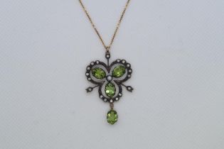 A 9ct yellow gold and silver vintage style necklace set with peridots, diamonds and a seed pearl,