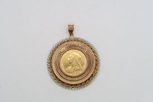 An 1894 gold sovereign set as a pendant in 9ct gold (hallmarked) gold - approx 4.5cm diameter -