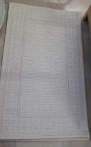 Three cream woollen rugs - 152cm x 90cm - in good condition