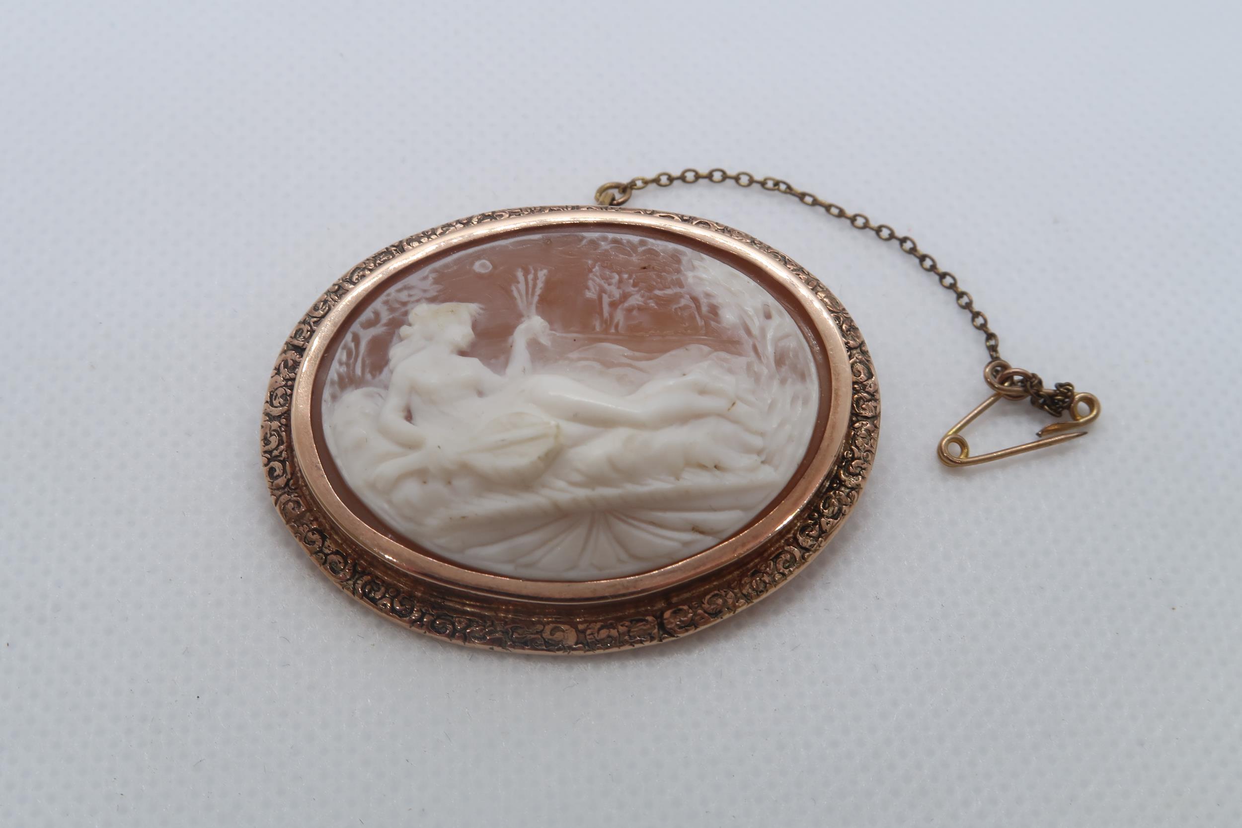 A 9ct rose gold (hallmarked) cameo brooch - 4.5cm x 4cm - approx weight 16.1 grams