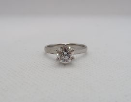 A classic diamond solitaire ring with accompanying AGI certificate - The round brilliant cut diamond