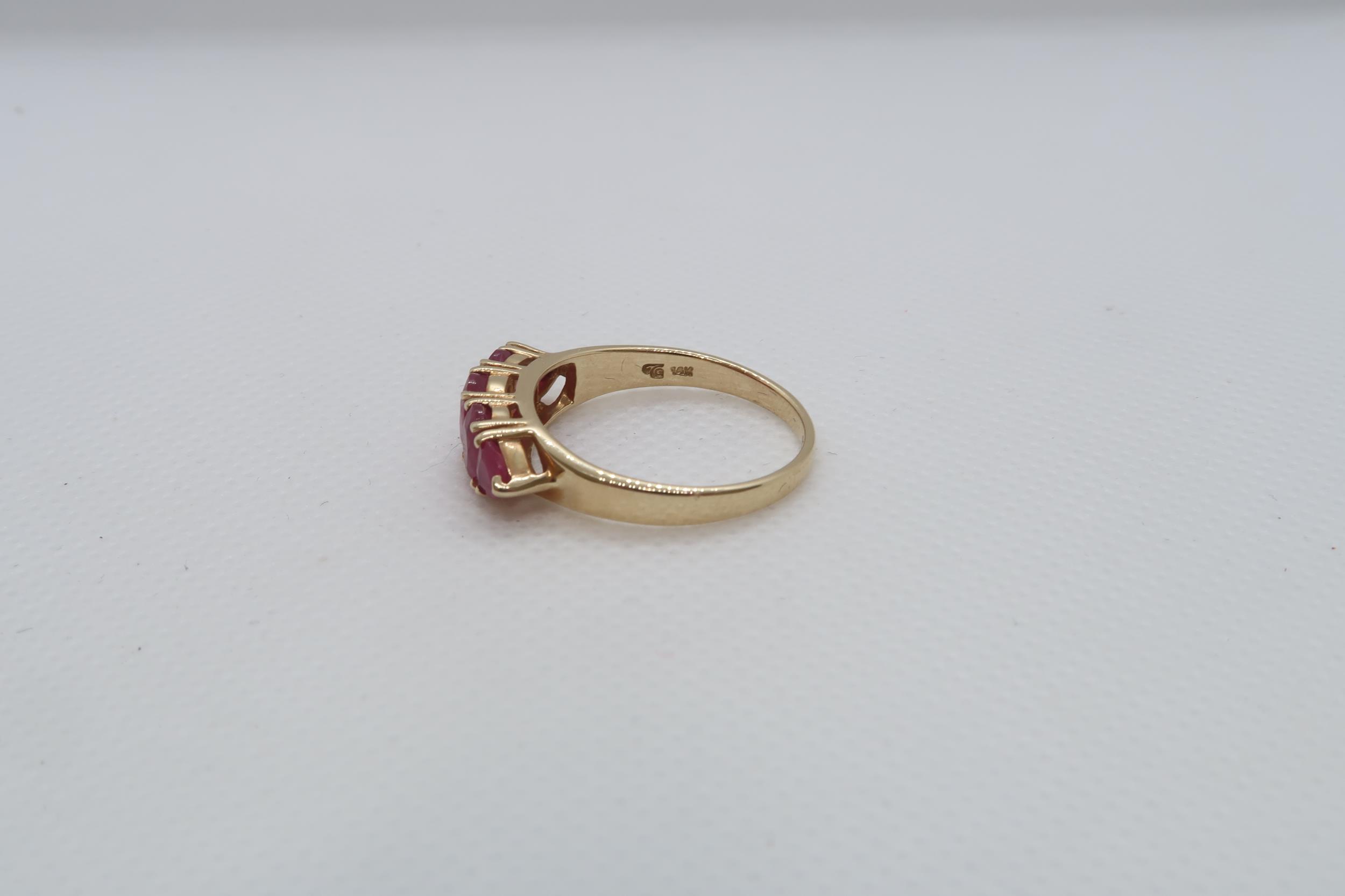 A 14ct yellow gold (hallmarked) and ruby five stone bridge ring size R/S - weight approx 3.7 grams - Image 4 of 4
