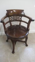 A 19th century mahogany revolving desk chair in good condition for its age, mechanism working