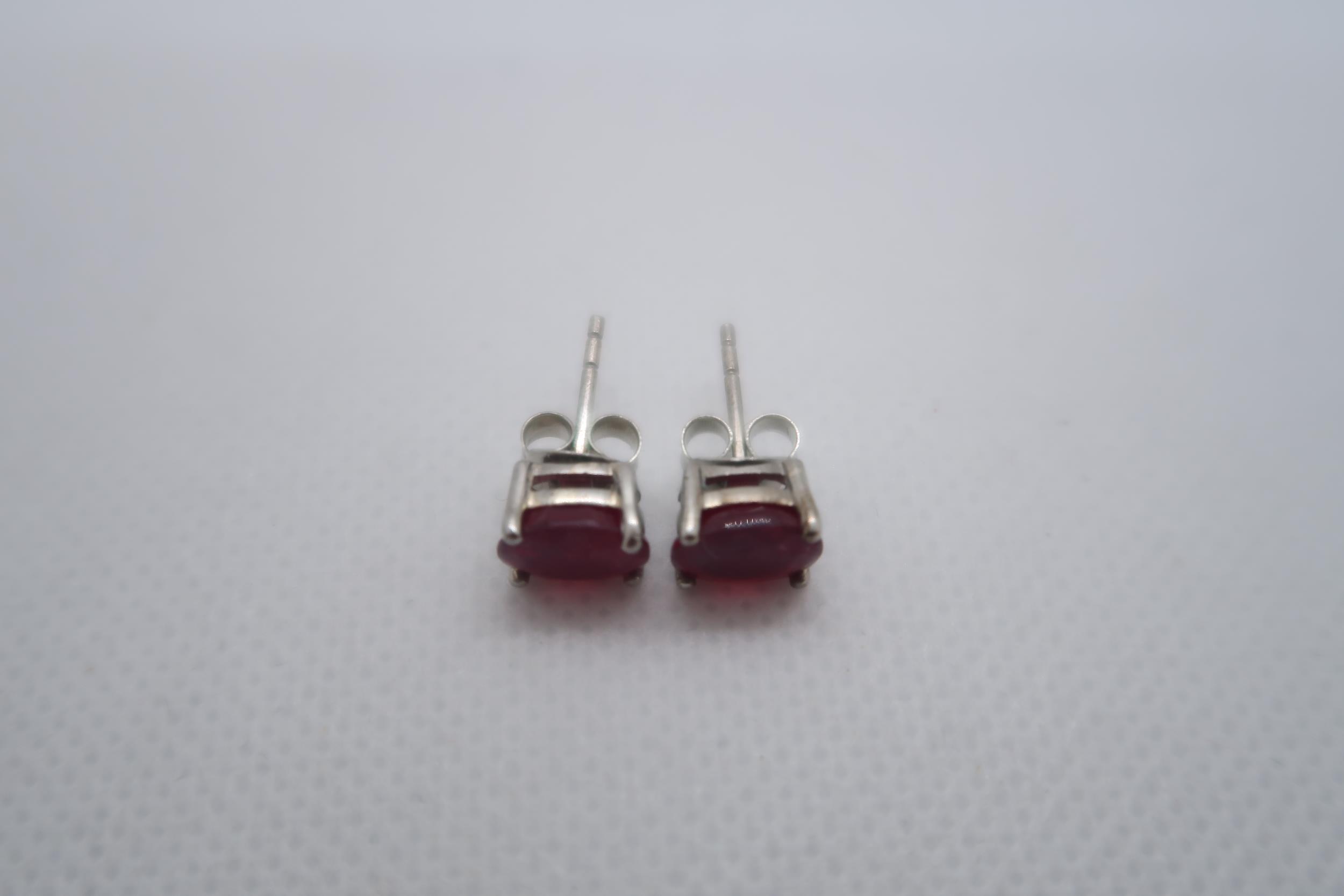 A pair of treated ruby studs set in silver - Image 2 of 2