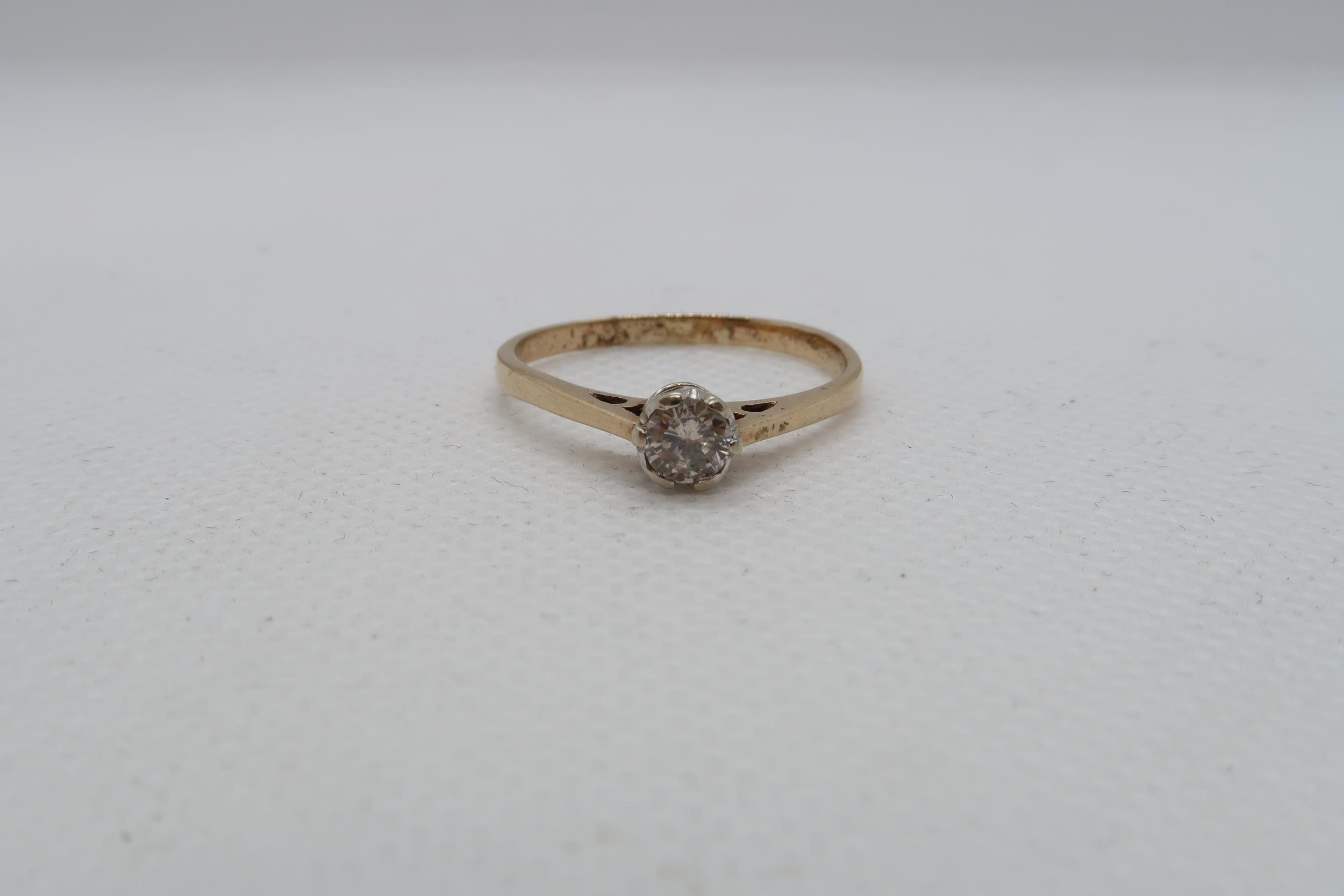 A 9ct yellow gold 0.30ct diamond ring - carat weight marked on inside of ring - ring size approx S - Image 4 of 4