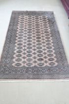 A Khara cream hand knotted woollen rug - 244cm x 155cm - original cost £775 - reasonably good