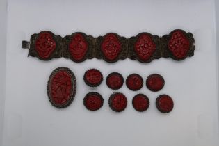 A suite of Chinese cinnabar lacquer jeweller on copper buttons, bracelet and brooch