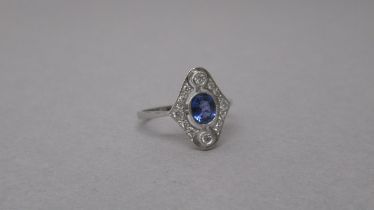 A platinum Art Deco style sapphire and diamond ring - head size approx 15mm x 12mm - ring size