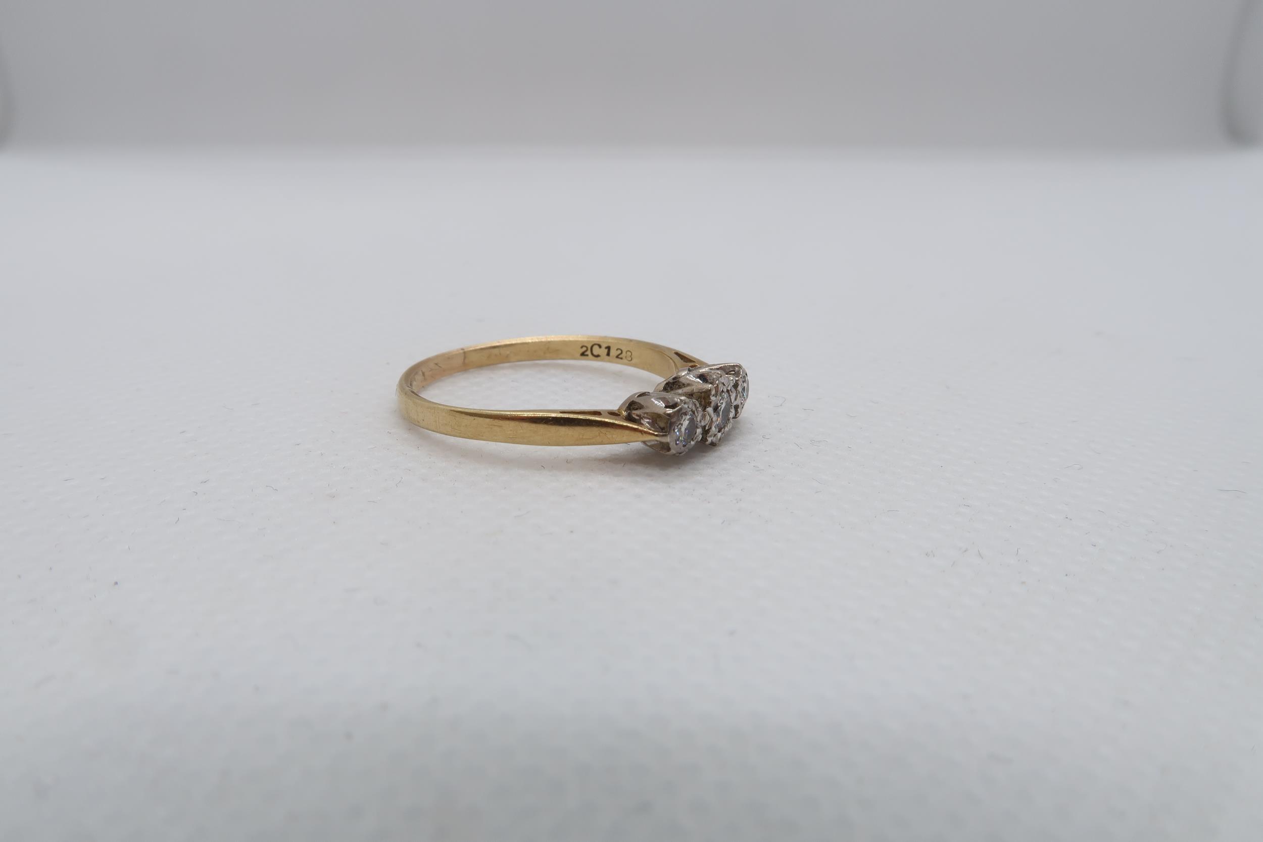 An 18ct yellow gold (hallmarked) three stone diamond ring size R - weight approx 2.8 grams - Image 2 of 3