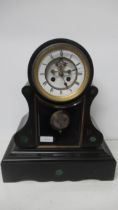 An antique slate marble clock with veined green marble inset roundels, strikes on the half and the