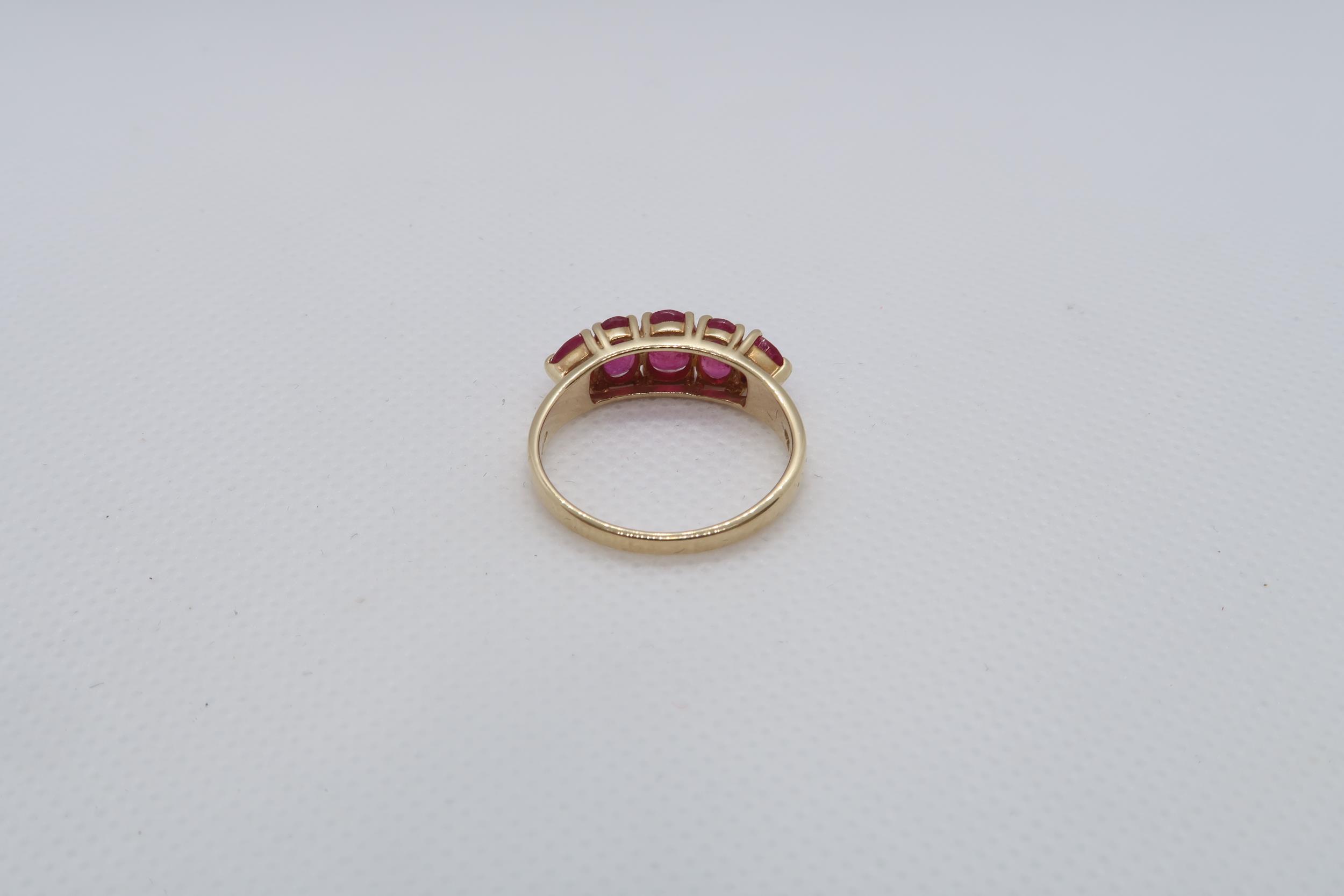 A 14ct yellow gold (hallmarked) and ruby five stone bridge ring size R/S - weight approx 3.7 grams - Image 3 of 4