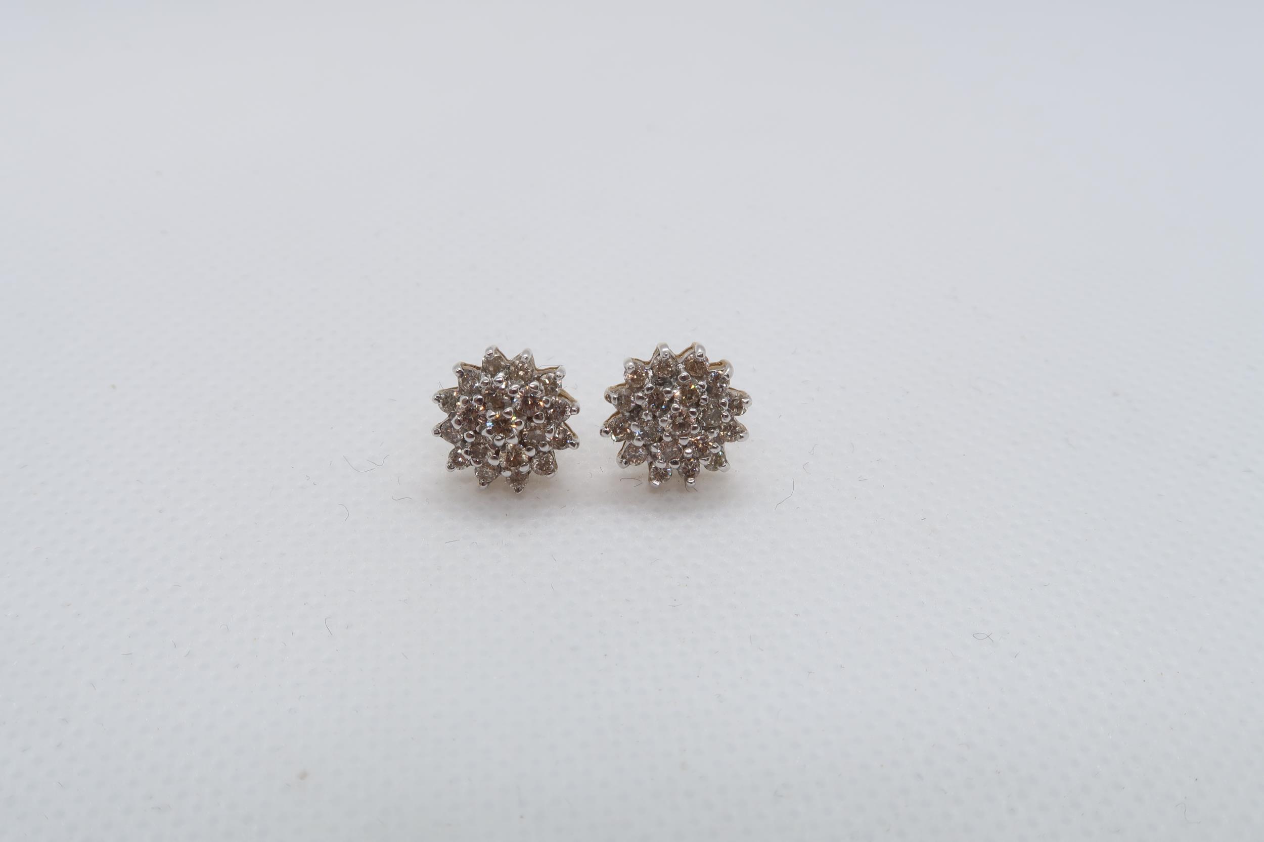 A pair of 9ct yellow gold (hallmarked) diamond cluster ear studs - approx 11mm - approx weight 2.3