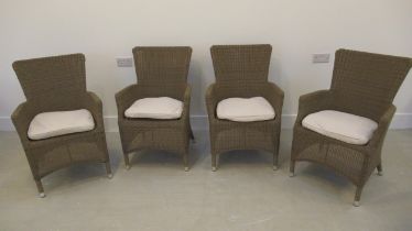 A set of four Neptune rattan style garden chairs with cushions