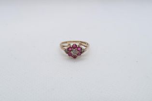 A 9ct yellow gold (hallmarked) ruby and diamond cluster ring size I/J - approx weight 1.8 grams