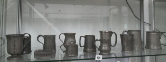 Twelve items of antique Pewter, mostly mugs