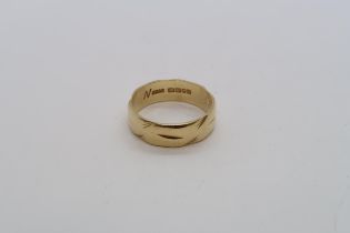 An 18ct yellow gold hallmarked band ring, size M, approx 4.6 grams