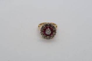 An approx 18ct yellow gold (tested) diamond and ruby cluster ring, size M, approx 6.4 grams